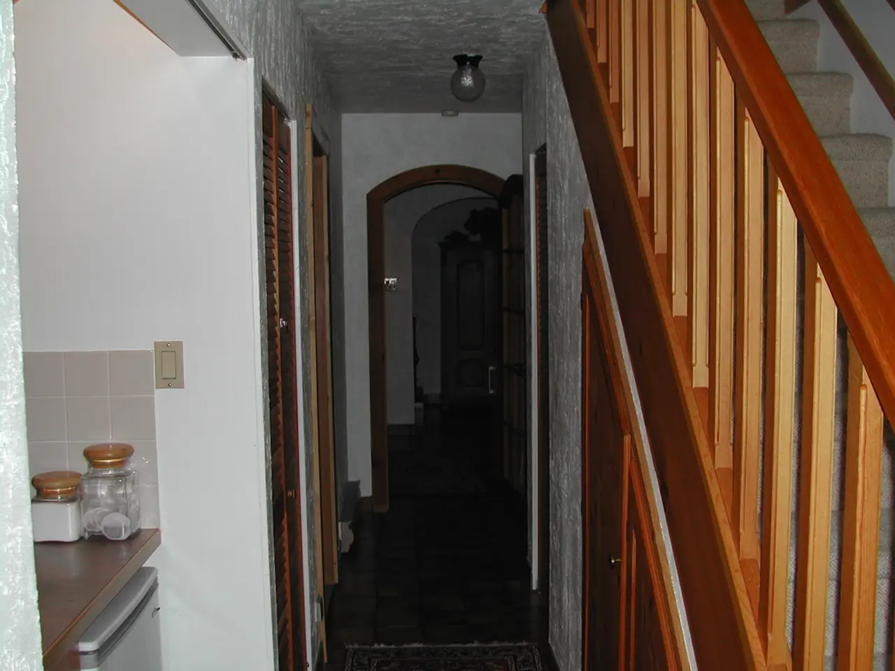 This image is clicked inside the house. To the right, there are stairs. The railing is made up of...