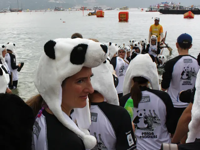Residents of Hsinchu County tidy up the coastline of Potou Village