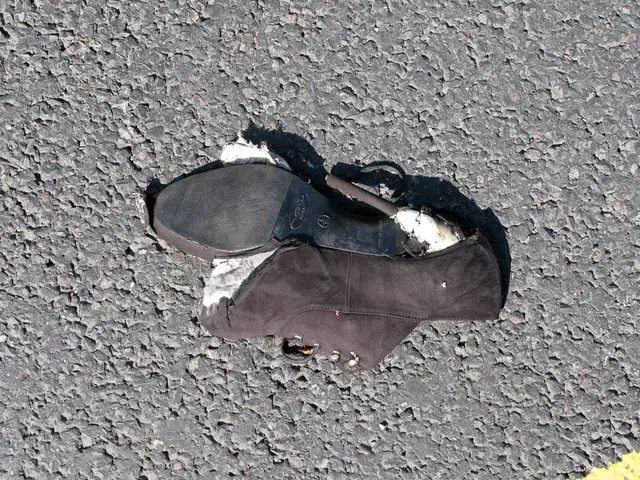 In this picture we can see a sandal on a surface.