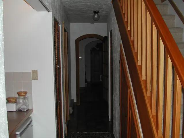 This image is clicked inside the house. To the right, there are stairs. The railing is made up of...